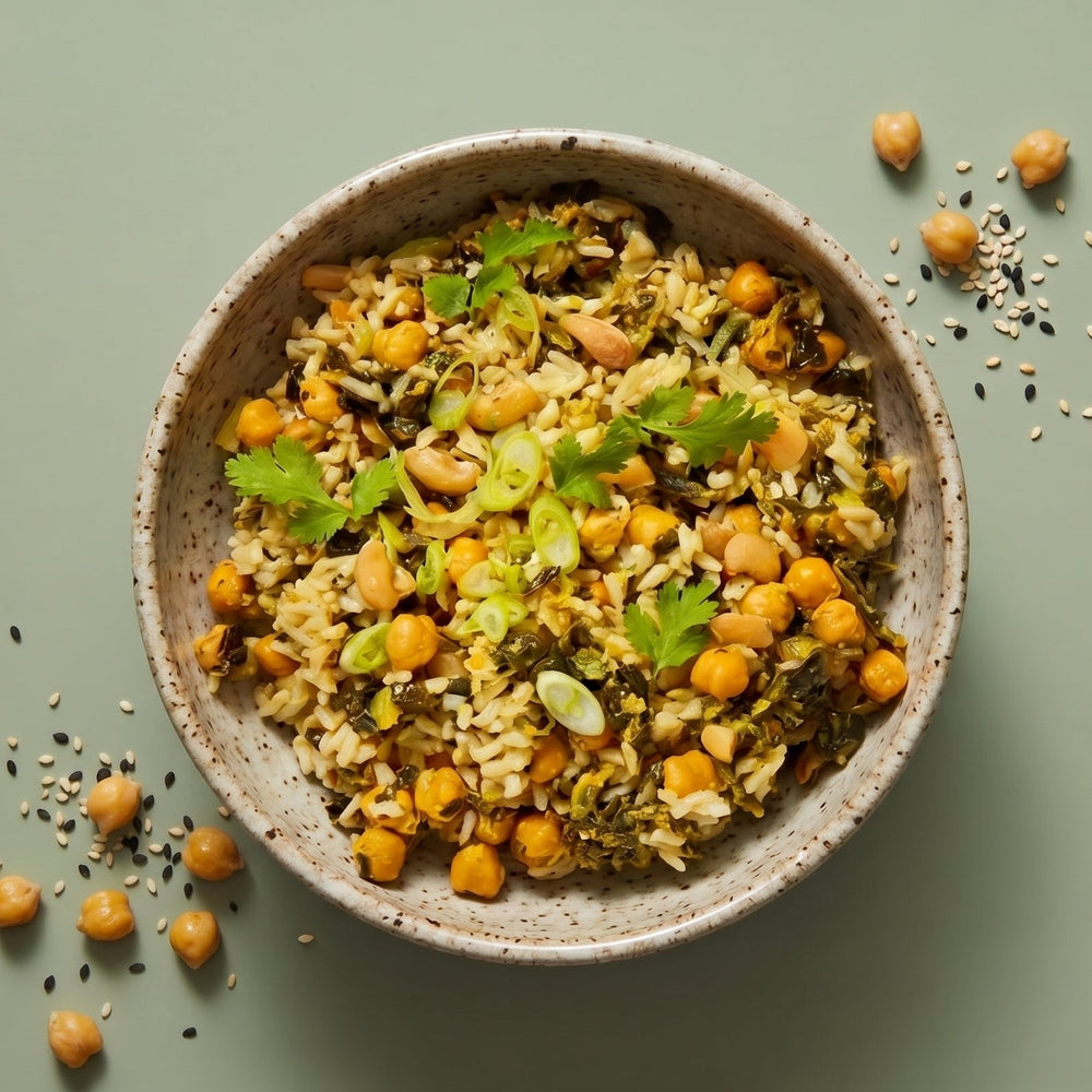 Plant-based Low Sodium Coconut Curry Rice served in a ceramic bowl with roasted vegetables and cilantro.