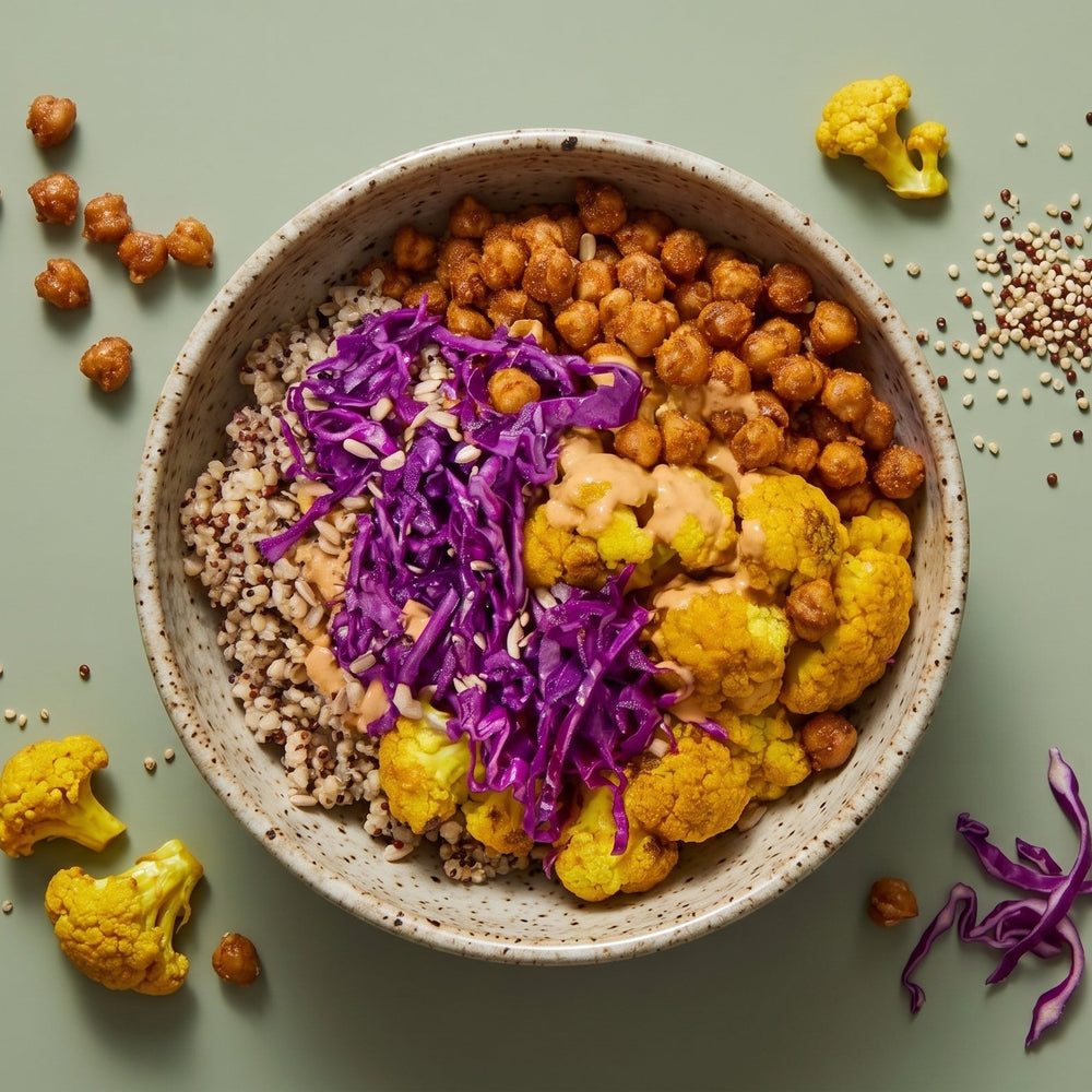 Purple Grain Bowl with yellow turmeric cauliflower, red cabbage slaw, and quinoa grain blend.